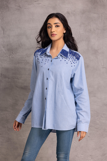Blue chambray  shirt with stone detailing  to enhance the overall look.