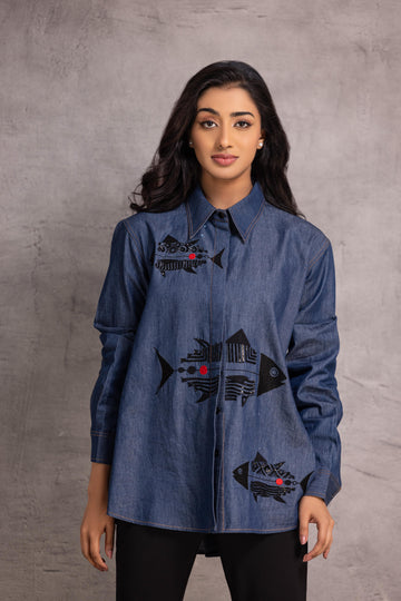 Denim  shirt with a fish motif enhanced by sequin and thread work.