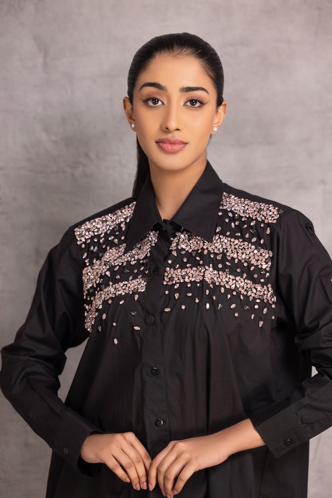 Black cotton  shirt with stone detailing  to enhance the overall look.