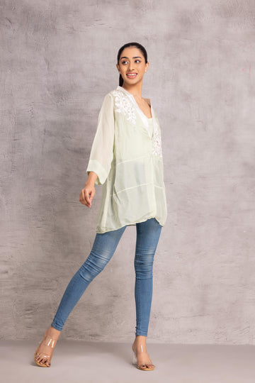 Green Organza loose-fit shirt with a sheer finish and patchwork floral motifs, creating an elegant and joyful look